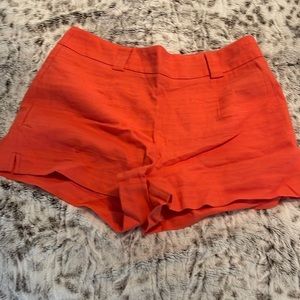 Orange shorts for tucking shirt in w belt